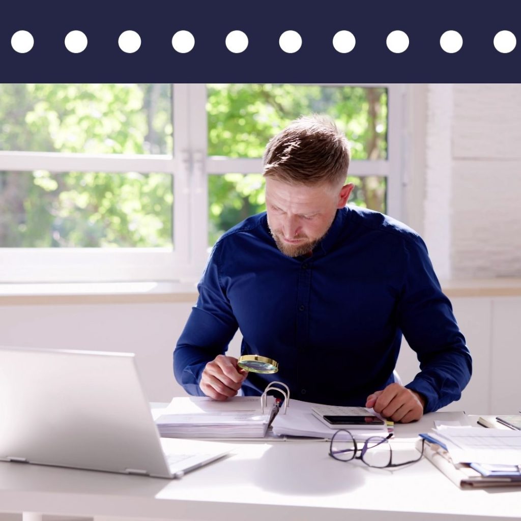 Private investigator looking over information