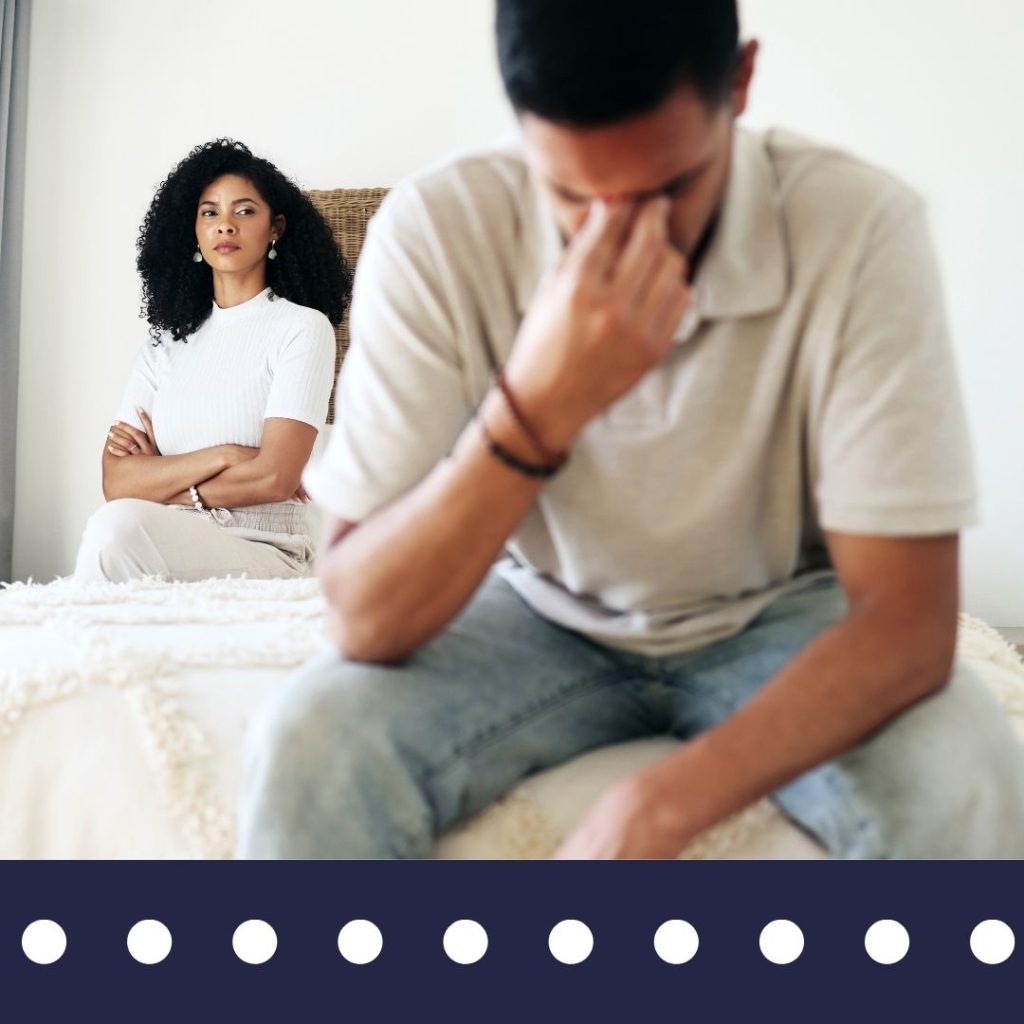 Couple sitting apart on bed representing emotional distress from suspected infidelity – Blue Falcons Investigation